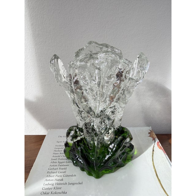 A vase in the green colourway of the "Kasvimaalla" series - the name is Finnish for "in the vegetable garden" - designed...