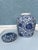 Late 20th Century decorative blue and white ceramic ginger jar. It has a chinoiserie floral and vine motif. The jar and...