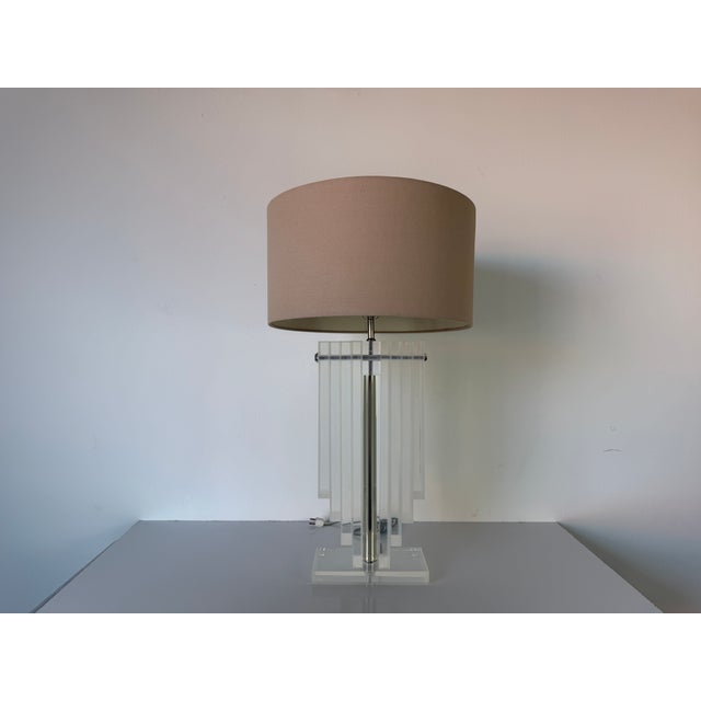 A beautiful Vintage Karl Springer- style architectural heavy stacked Lucite decorative table lamp with original chrome...