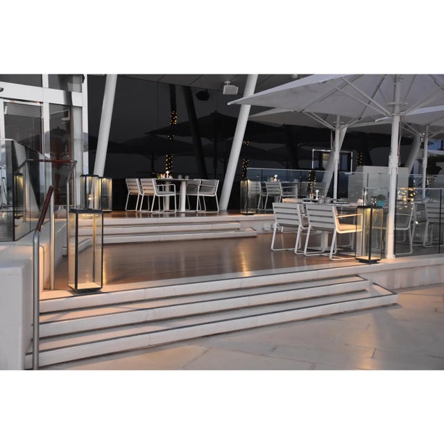 Eclectic floor light in dark bronze with outside fitted clear glass, 5 meter cable H05RNF and plug. For outdoor use...