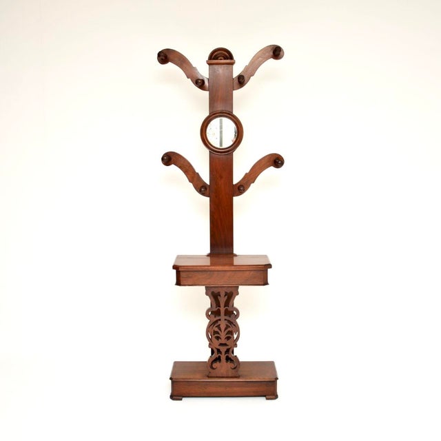 A beautiful and functional antique Victorian tree hall stand, made in England and dating from around the 1870-1890 period....