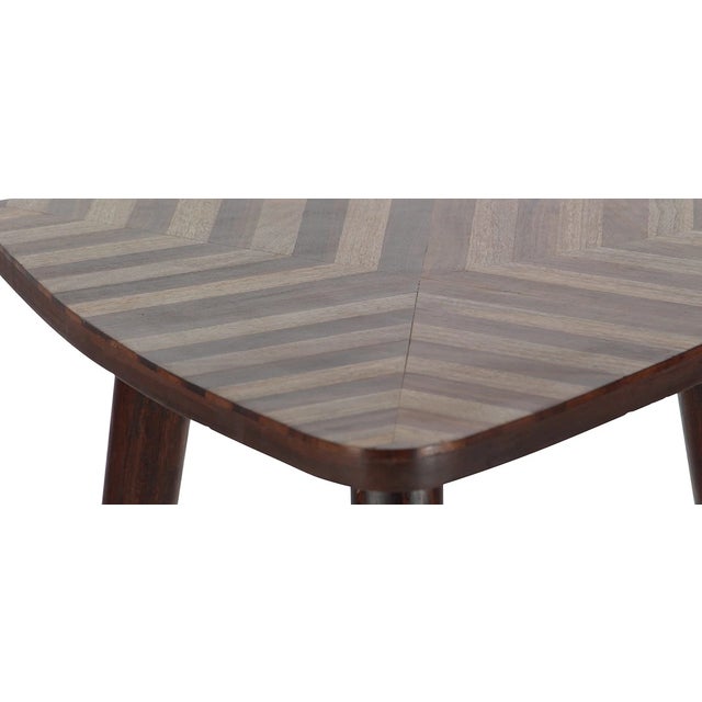 Handcrafted vintage mid-century modern side table made from solid mango wood. This piece features a simple yet sculptural...