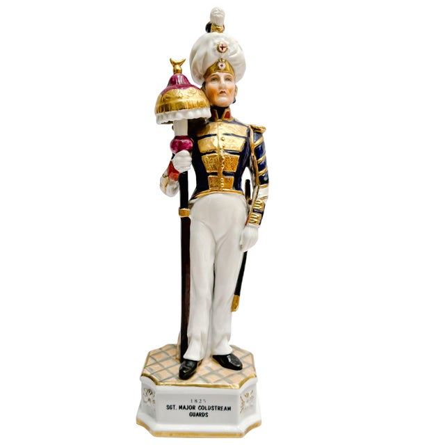 Set of three mid-century porcelain British Military Guard figurines by Royal Crown Devon. Made in England and standing an...