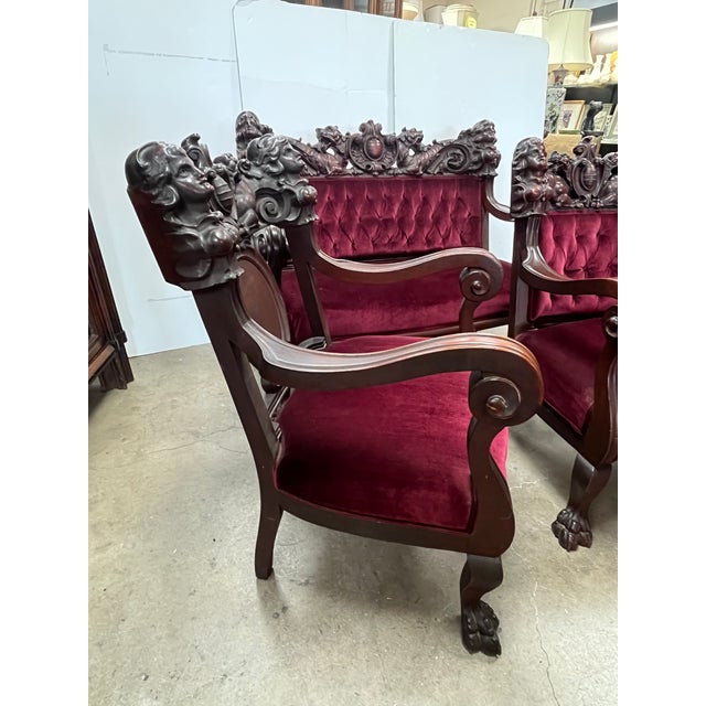 This is a Karpen mahogany figural highly carved 3 piece parlor set with burgundy velvet upholstery. Completely all...