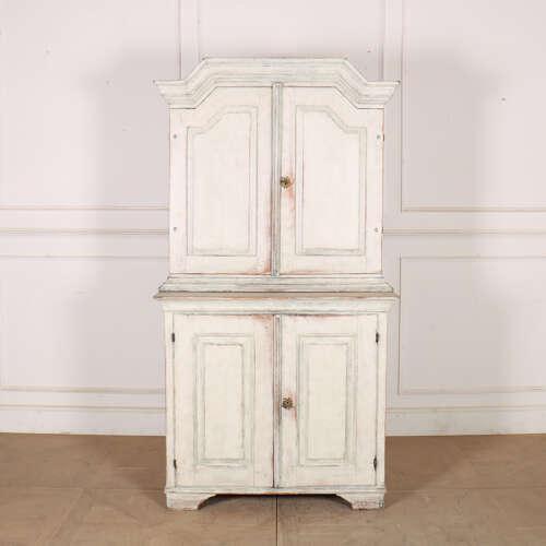 Early 19th century Swedish painted pine linen cupboard. 1820. Interior depth of top section: 12-inches. This piece is...