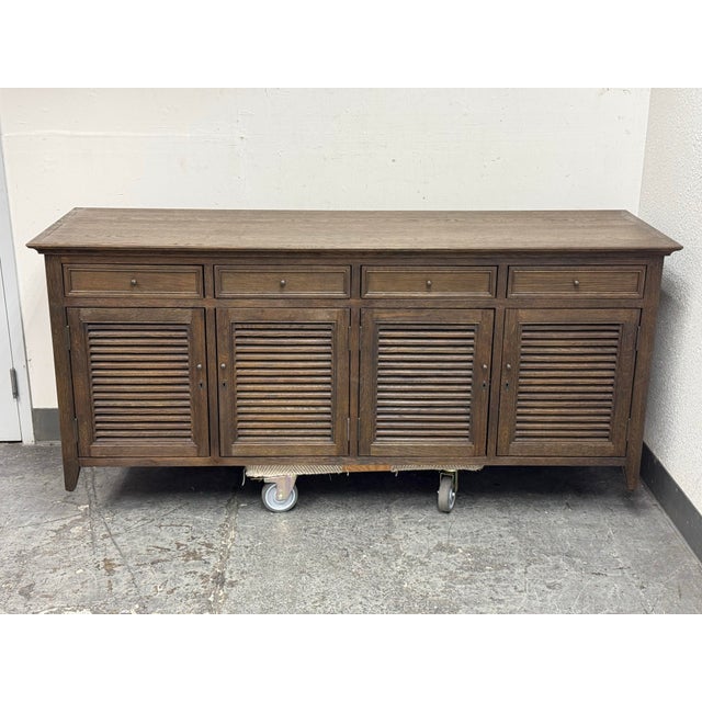 Design Plus Gallery presents the Driftwood Oak Shutter Sideboard from Restoration Hardware. The angled louvers reference...