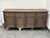 Design Plus Gallery presents the Driftwood Oak Shutter Sideboard from Restoration Hardware. The angled louvers reference...