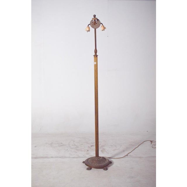 This vintage Danish floor lamp from the 1950s is crafted in metal with a tall, slender column that emphasizes its elegant...