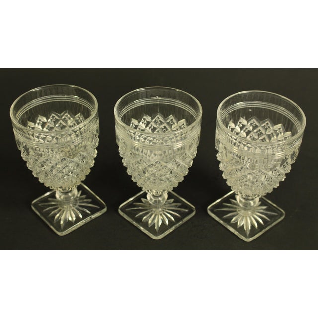 An early elegant set of 3 pub drinking vessels, aka rummers or raised goblets Pressed flint glass decorated with...