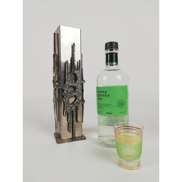 Sculptural vase from the 70s in a brutalist style. The structure of the vase develops on two levels. The first level is a...