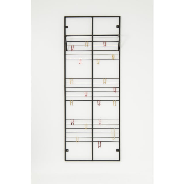 A first edition ‘Toonladder’ coat rack, designed by Coen de Vries in 1953 and manufactured by his own company DEVO in...