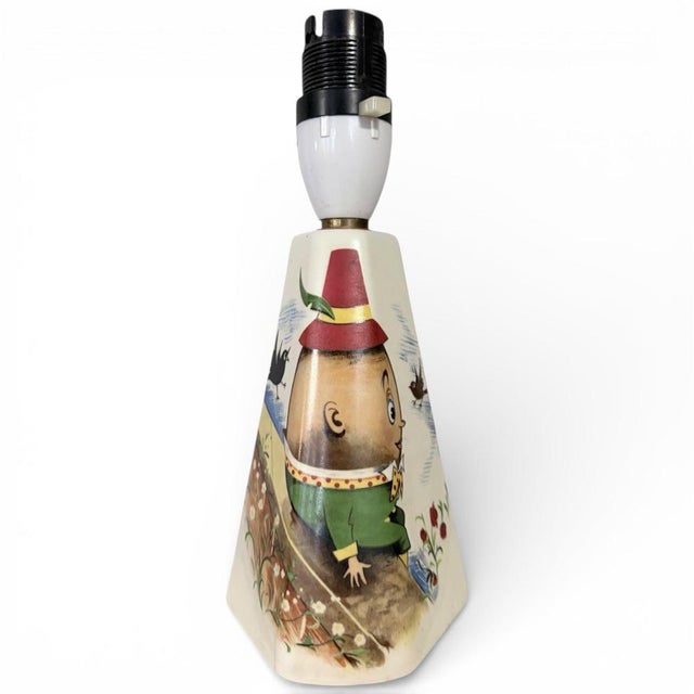 This vintage ceramic lamp base brings nostalgic charm and whimsical style to your home with its hand-painted Humpty Dumpty...