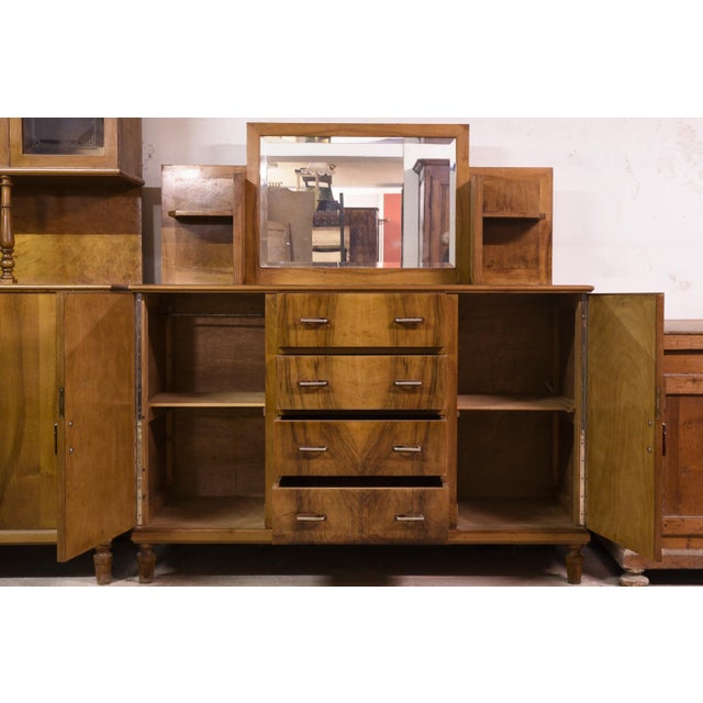 Sideboard complete with small open shelves that frame the central beveled mirror , italy 1940 the structure is very...