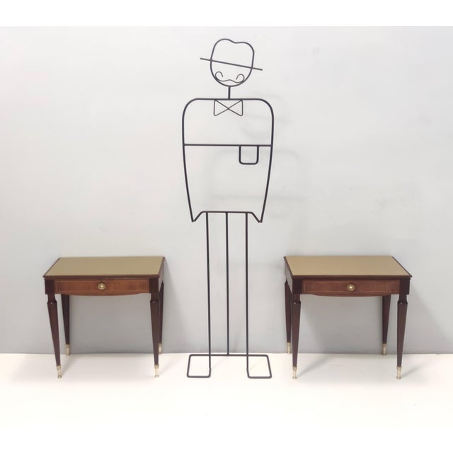 Made in Italy, 1950s - 1960s. They feature a beech and ebonized walnut frame, brass handles and feet caps and back-painted...