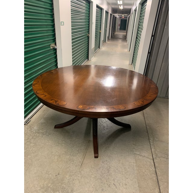 Beautiful pedestal dining table originally purchased from ABC Home in New York. Some minor scratches on the table top.