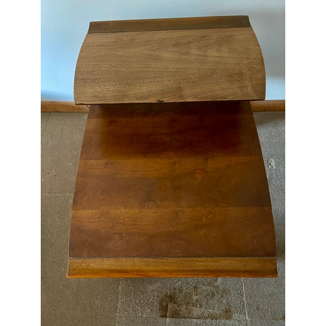 Mid century modern double tier side tables by Lane. Lane is a historically significant American manufacturer renowned for...