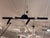 Design Plus Gallery presents the Oaks Tall Wall Sconce from Avenue Lighting. This modern wall sconce has a black metal...