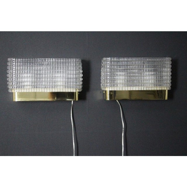 This magnificent pair of rectangular wall lights sconces from Murano was made in Murano . They feature a classical and...