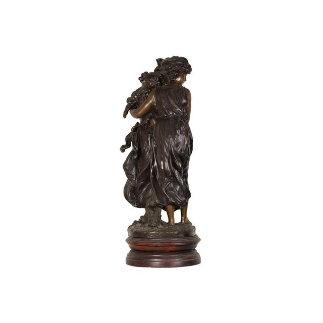 A bronze tabletop sculpture, two girls with the loose tunic in the wind hugging each other - Persephone the Goddess of...