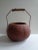 Rustic round gourd basket. Metal and bark handle. Brown. Perfect for dried flowers or as a centerpiece on your table.
