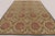 Handwoven in wool originating circa 1950-1959, this 12x17 oversized vintage French Aubusson rug features a repeating...