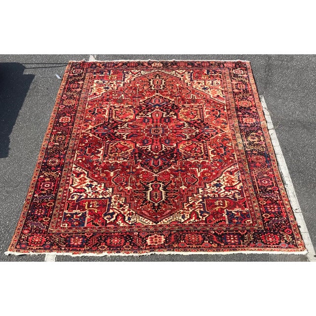 An awesome geometric design heriz rug.It measures 9’9”x13’2”it has been cleaned by professional rug cleaners.it is in an...