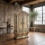 Ornate French-inspired armoire with a Rococo aesthetic, featuring a serpentine silhouette, deep relief carvings, and a...