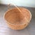 VERY large, Hand woven round basket with attractive natural fibers. The trim has a pretty cross stitch pattern. Many uses...