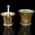 This is a duo of antique mortars with pestle. An English, bronze apothecary aid, dating to the early Georgian period,...