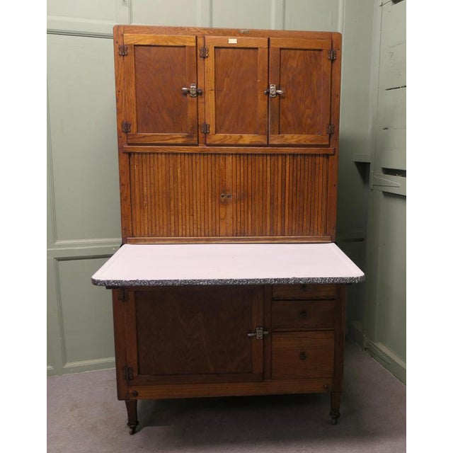 An American Oak Hoosier Kitchen Cabinet by Hudson Bros This one is in Good Original condition, it made in Oak, and has...