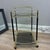 This sophisticated late- 20th- century drink trolley exemplifies contemporary Italian elegance. The design features black...