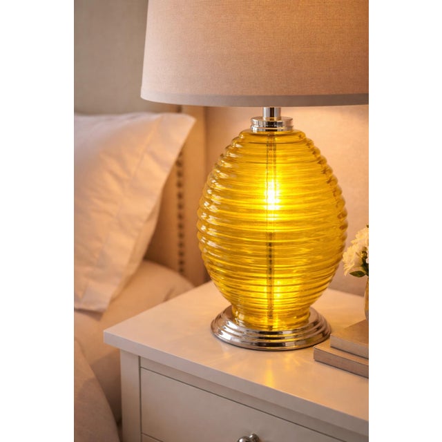 This striking pair of vintage citron ribbed glass table lamps offers sculptural form, vibrant color, and exceptional...