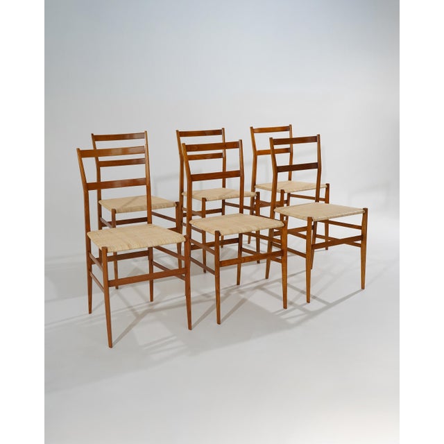 A set of six “Superleggera” dining chairs designed by Gio Ponti for Cassina in the 1950s, one of the most radical...