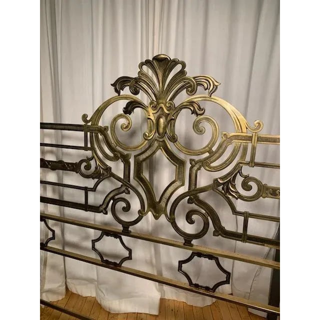 Italian gilt metal headboard from mid 20th c. This headboard features foliate crest, flanked by finials, with openwork...