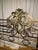 Italian gilt metal headboard from mid 20th c. This headboard features foliate crest, flanked by finials, with openwork...