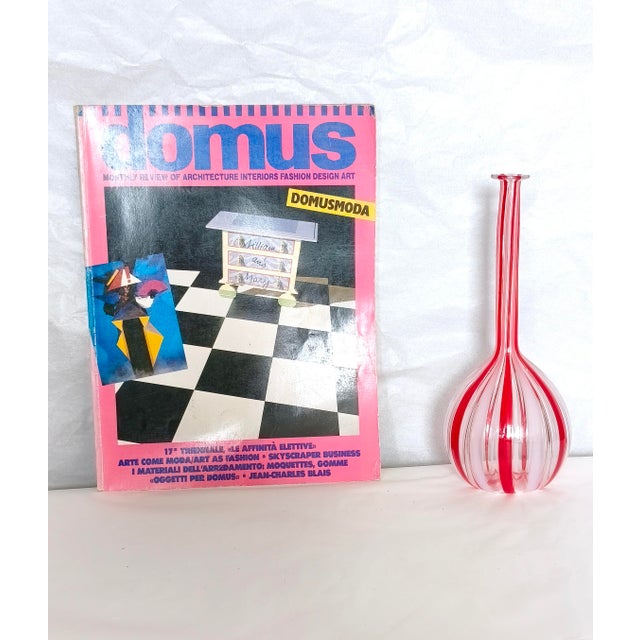 Made in Italy, 1970s. It is an amazing piece made in blown glass with red, white and transparent canes. This recalls Gio...
