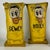A rare set of 3 Mid 20th Century Americana carnival fairground circus knock downs in sunny yellow. They feature Hooey,...