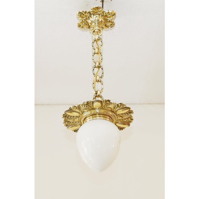 Art Nouveau Pendant Lamp Art Nouveau lamp made around 1900. Ceiling rosette and body made of solid cast brass. Decorative...
