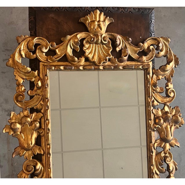 Early 20th French Empire period carved gilt wood rectangular mirror with crest An exceptional hand carved and gilded...