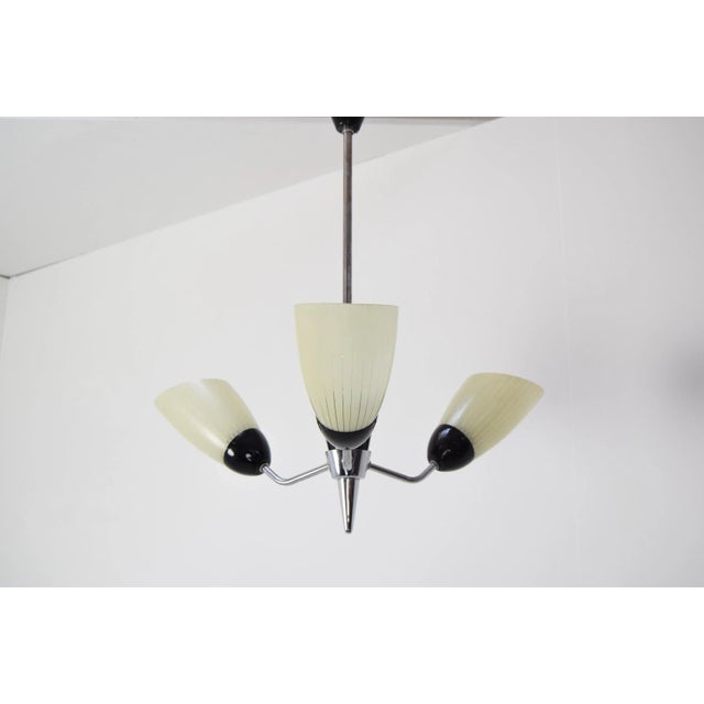 Made in czechoslovakia. Made of glass, lacquered metal, chrome. New cabling 3x 60w,e27 or e26 bulb. With aged patina us...