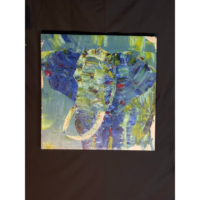 Vibrant abstract oil painting on square canvas featuring an elephant rendered with thick, textured brushstrokes. The...