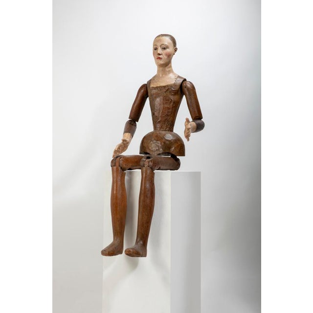 Stunning and rare jointed painter's mannequin, wooden shaft with painted hands and head and glass eyes. Italian production...