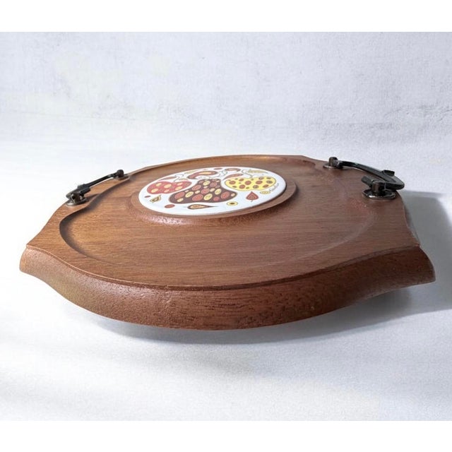 vintage mid-century modern wooden serving tray by Fred Press features a carved wooden platter with side handles and a...