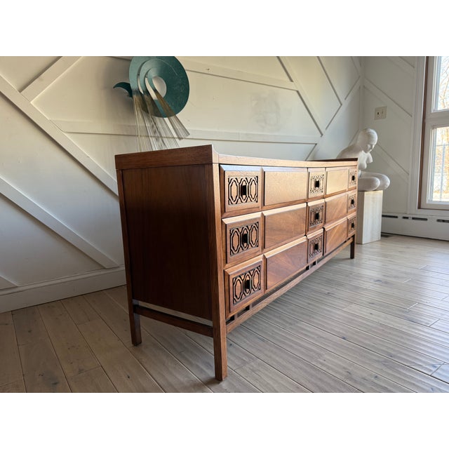 A rare gem you won’t find anywhere else. This refinished Mid-Century Modern 9-drawer walnut dresser by Rway is a true...