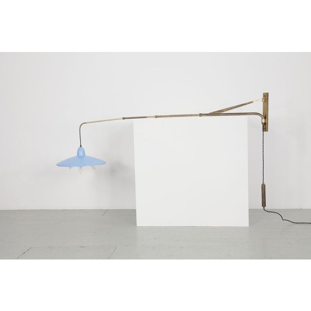 Pivoting height-adjustable Italian telescopic wall light from the 1950s. The shade is made of light blue lacquered...