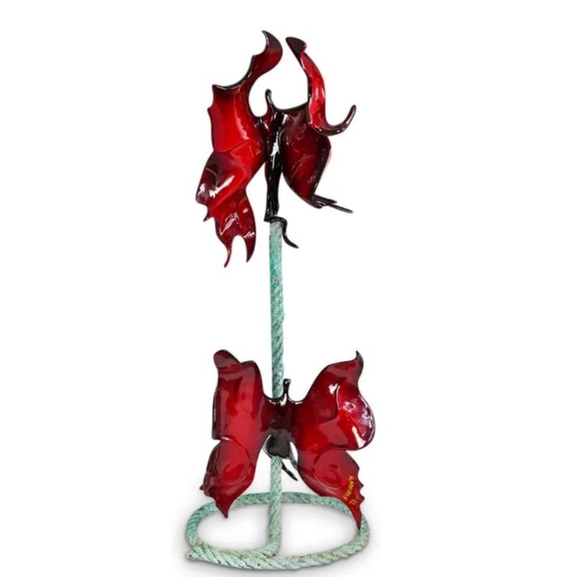 Gadi Fraiman (Israel, 1958-) A figural metal sculpture depicting a rope with ascending angelic butterfly like creatures...