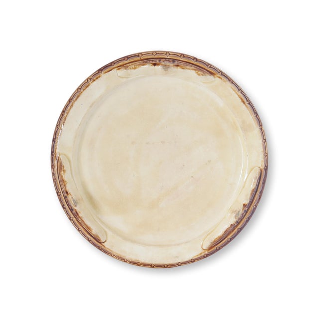 Charming French Majolica trivet, circa 1890, depicting a detailed dog in a kennel. Rich glazes in turquoise, green, and...