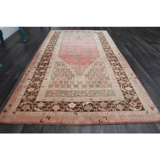 Vintage Hand-Knotted area rug is a semi-antique vintage area rug. The '70s Eastern region of Anatolia's unique rug is...
