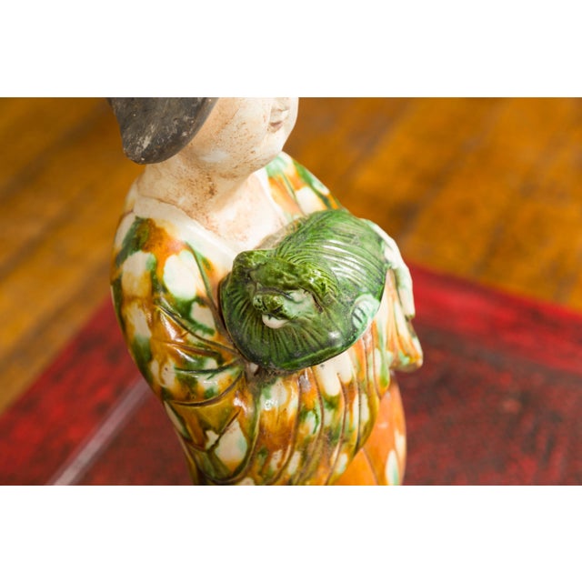 Orange Chinese Court Lady Statue with Egg and Spinach Pattern Kimono and Holding a Dog For Sale - Image 8 of 13