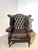Add timeless character to your interior with this stunning vintage wingback armchair, upholstered in rich brown leather...